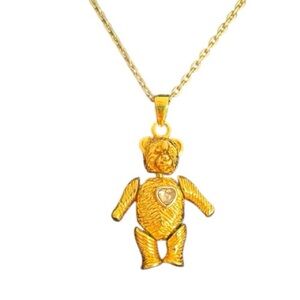 Vintage gold tone Avon? Teddy bear necklace with articulating legs arms and head